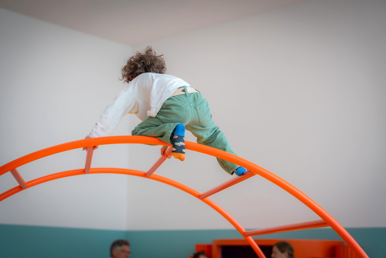 Child playing and climbing in the exhibition «CaccHho CucchhA»