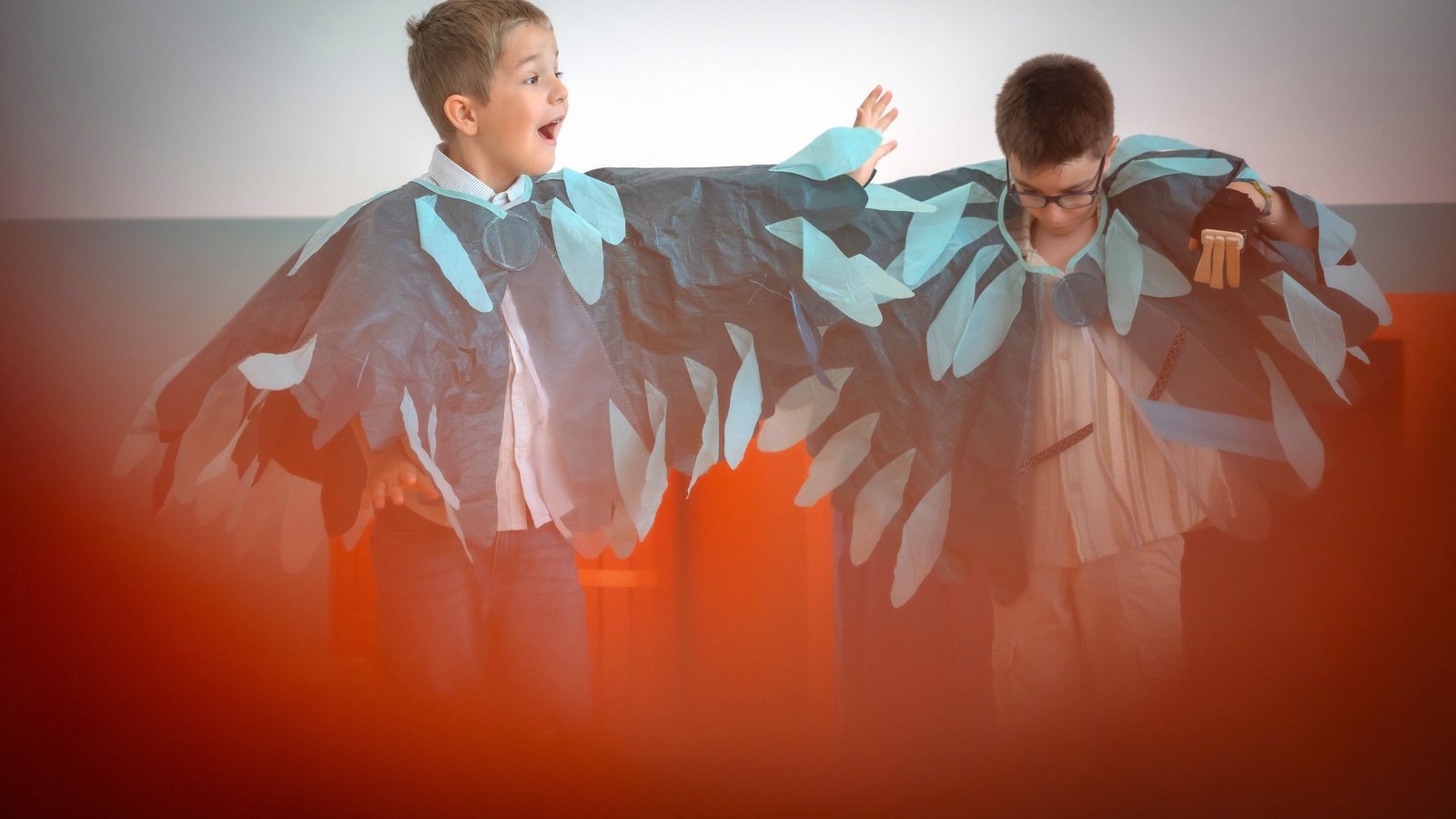Two boys in costumes singing and dancing in the exhibition «CaccHho CucchhA»